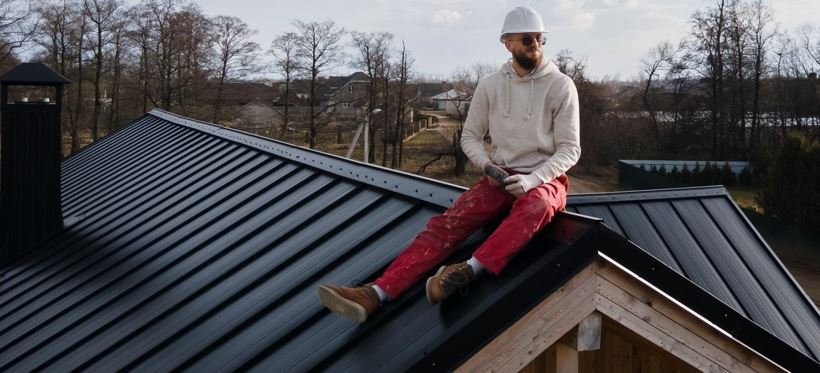 3/12 pitch roof with exposed-fastener metal roofing on a garage or outbuilding