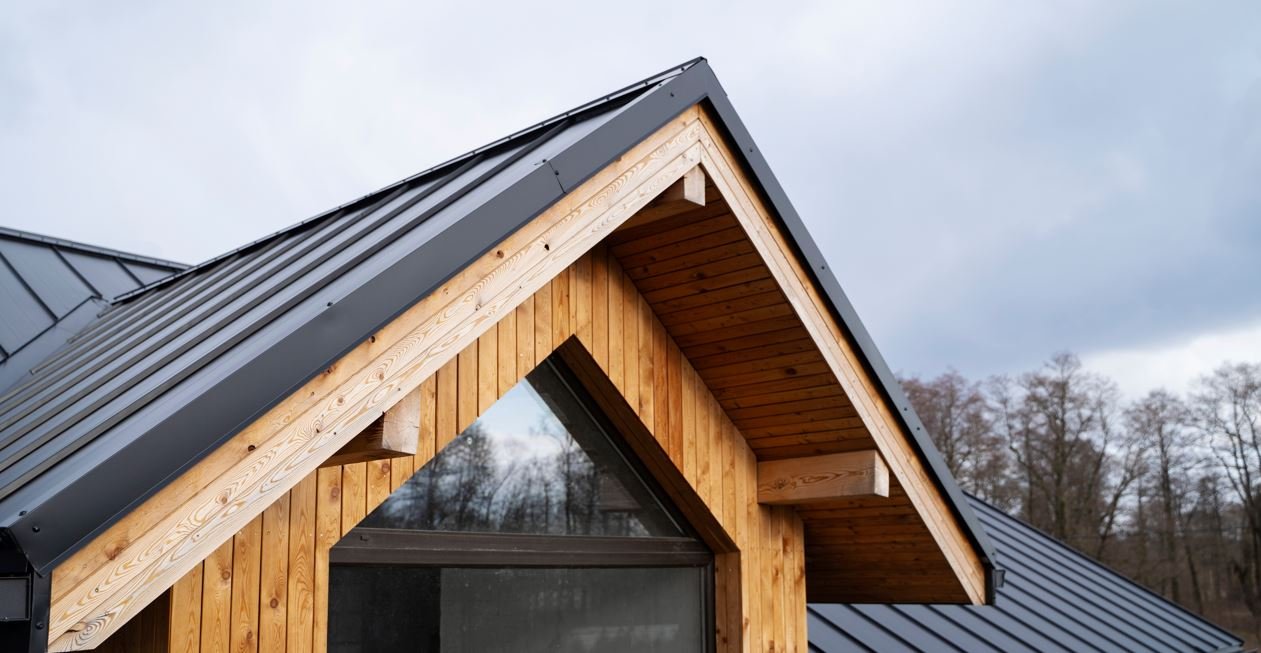 Roof trusses being set by crane on a residential frame