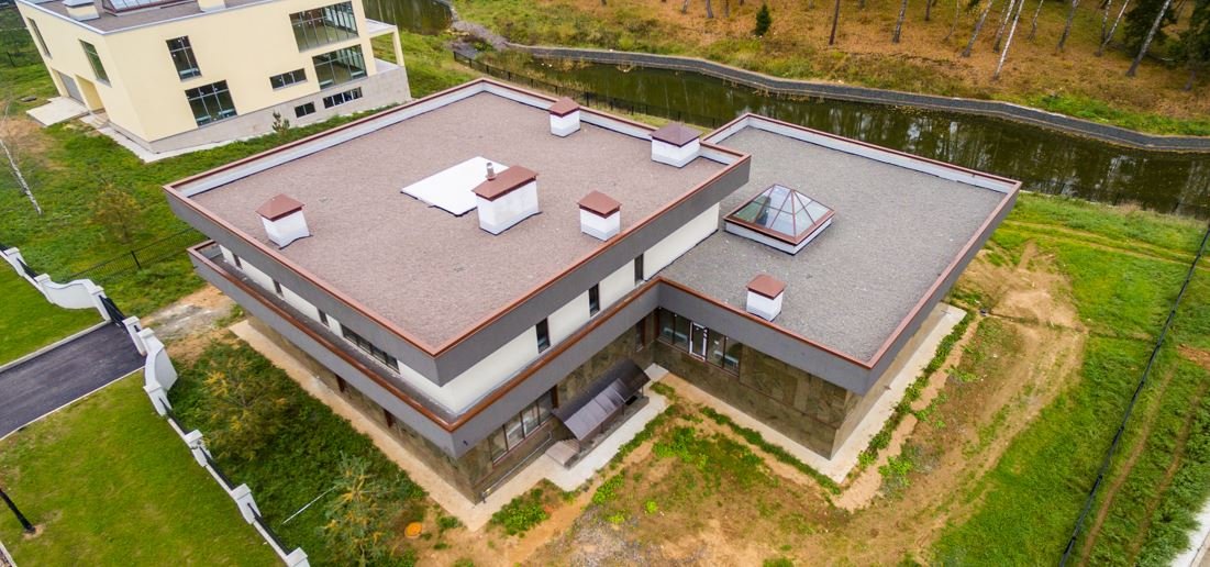 TPO and EPDM flat roof membranes installed on a commercial building